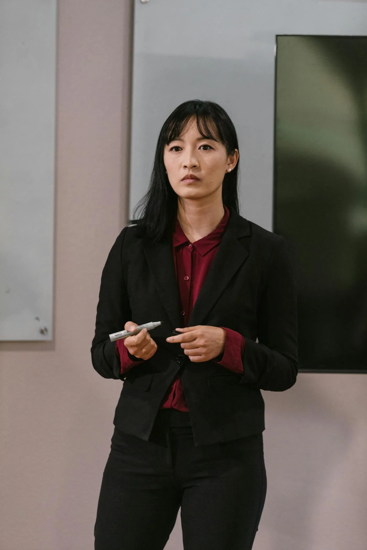 A leader pausing mid-presentation — sensing the room isn't moving with her