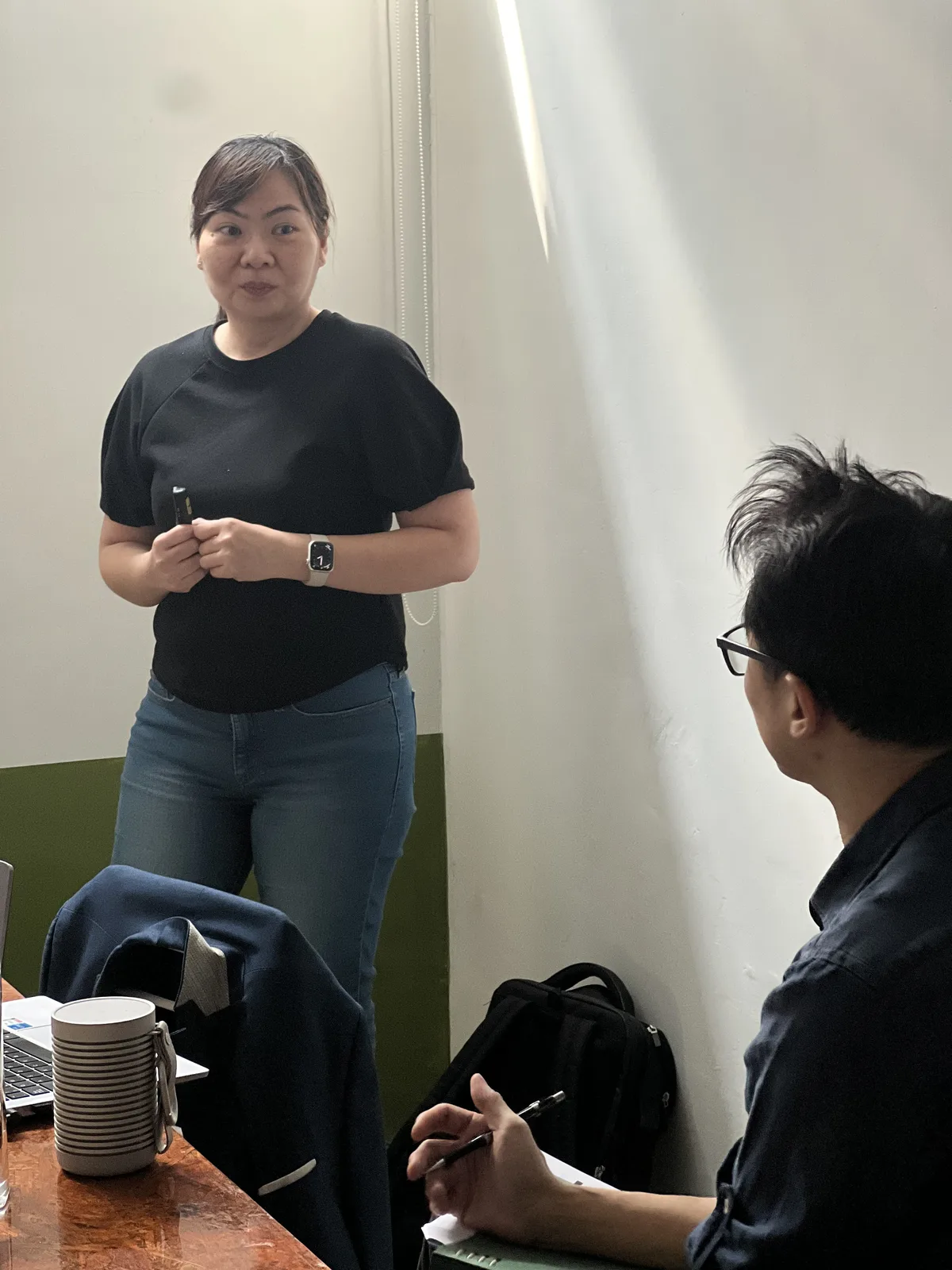 A participant practising in front of the room